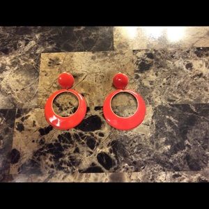 Large orange clip style earrings